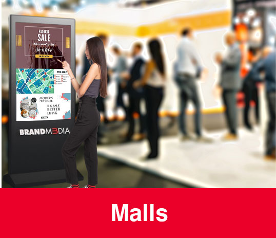 A girl using Digital Kiosk in a Mall